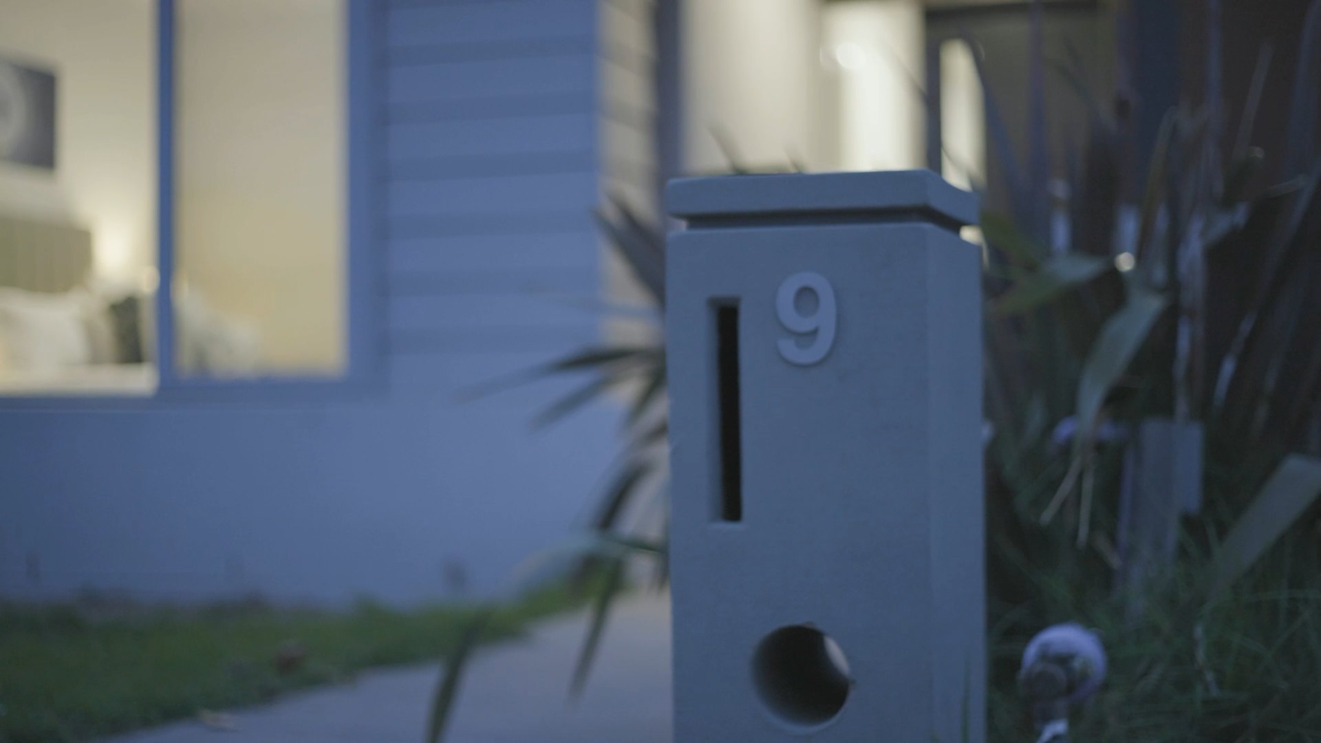 Letterbox at dusk outside a new listing, from a cinematic teaser